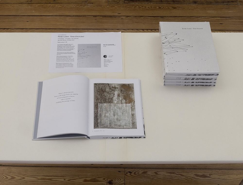 Rody Luton. Time Encircled — monograph, stacked copies and an open spread